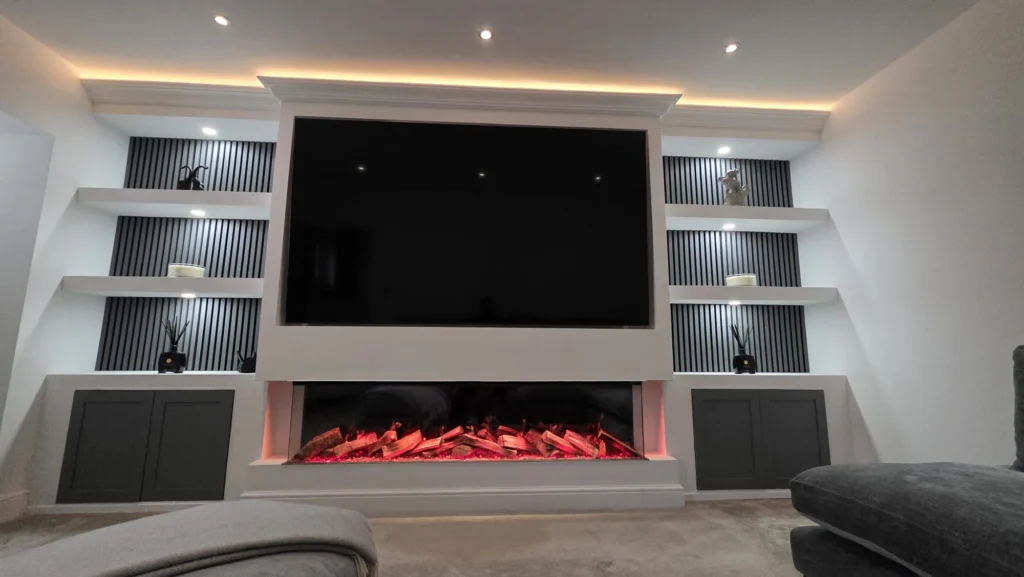 Contemporary living room media wall with electric fire and custom shelving