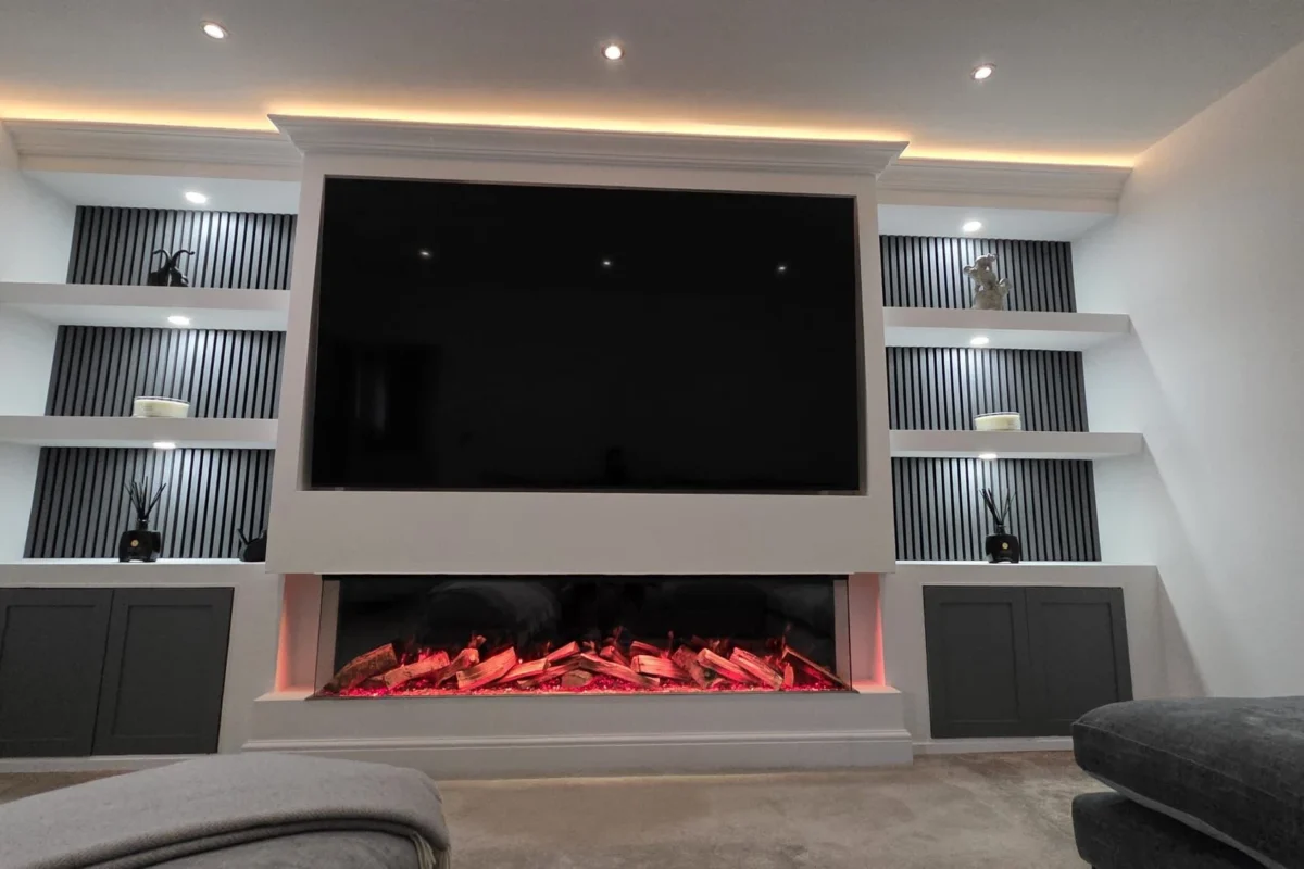 Bespoke media wall featuring a large TV, electric fireplace and LED lighting