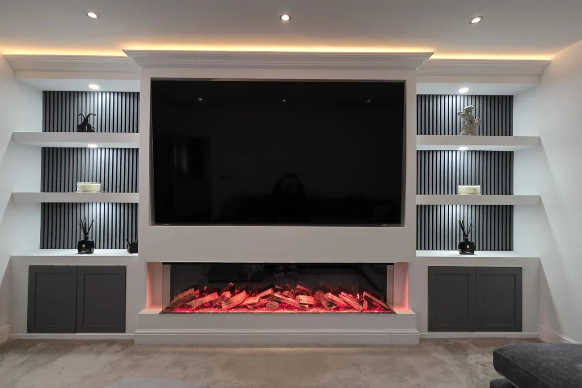 Contemporary living room media wall with electric fire and custom shelving