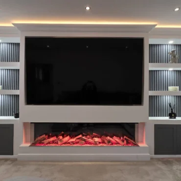 Contemporary living room media wall with electric fire and custom shelving